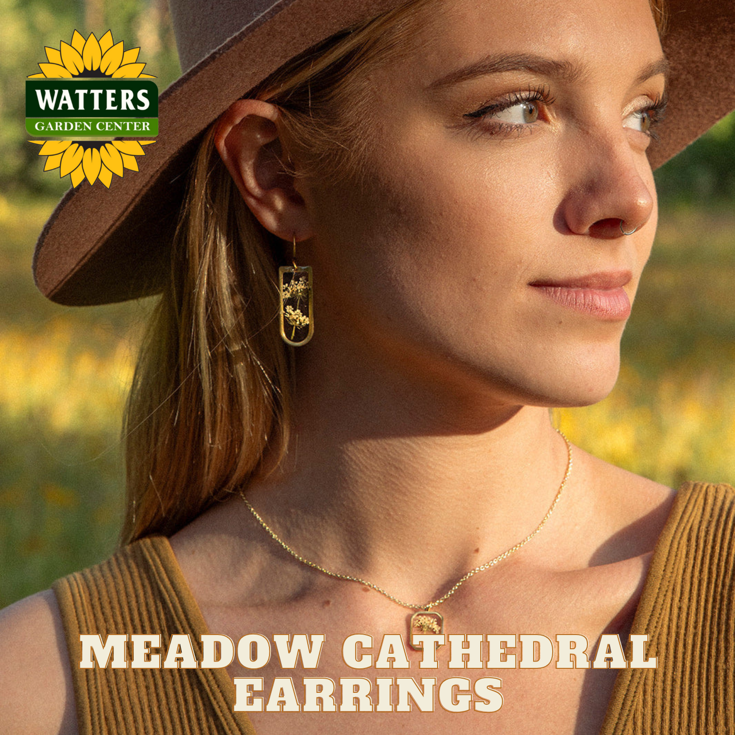 Woman wearing a brown hat and gold earrings with 'Watters Garden Center' logo.