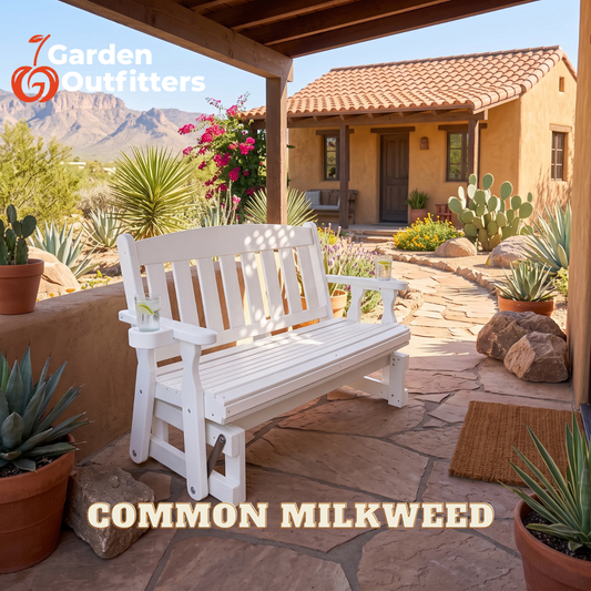 A white wooden garden bench with slatted back and seat, shown on a stone patio under a covered porch with desert plants and a stucco house in the background. The words 'COMMON MILKWEED' appear at the bottom, and the Garden Outfitters logo appears in the top left.