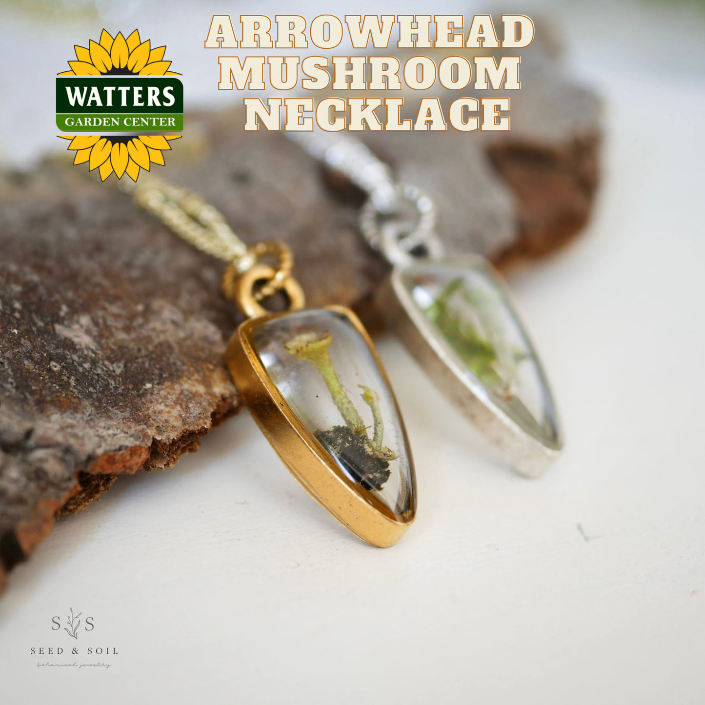 Necklace with arrowhead-shaped pendants on a rock background, featuring Watters Garden Center logo.