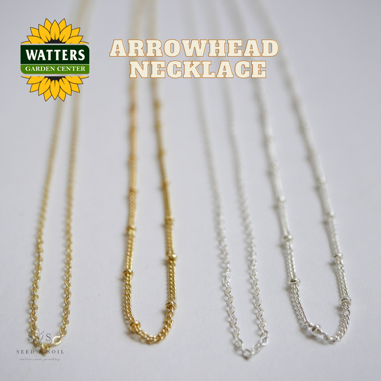 Two necklaces, one gold and one silver, on a light gray background with Watters Garden Center logo.