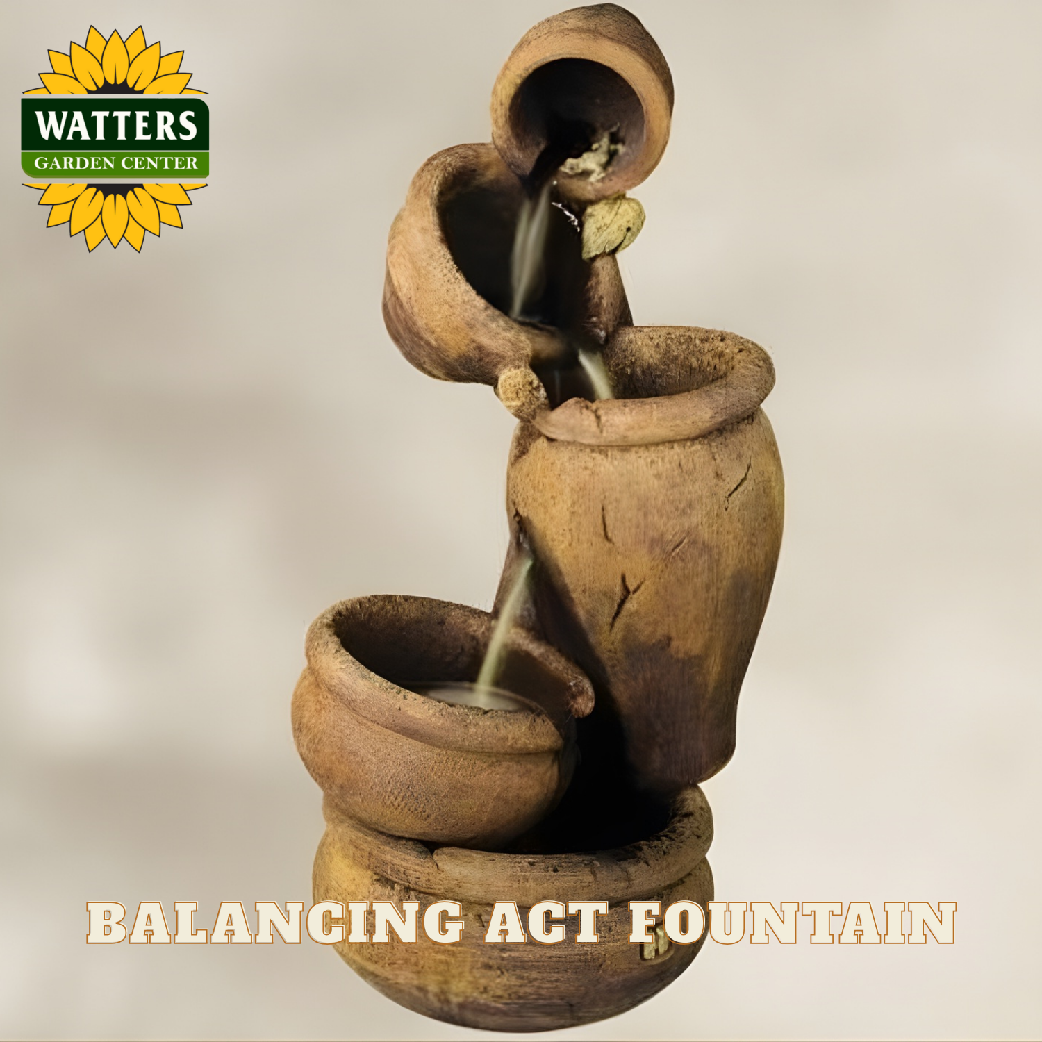 Terracotta balancing act fountain with Watters Garden Center branding on a neutral background