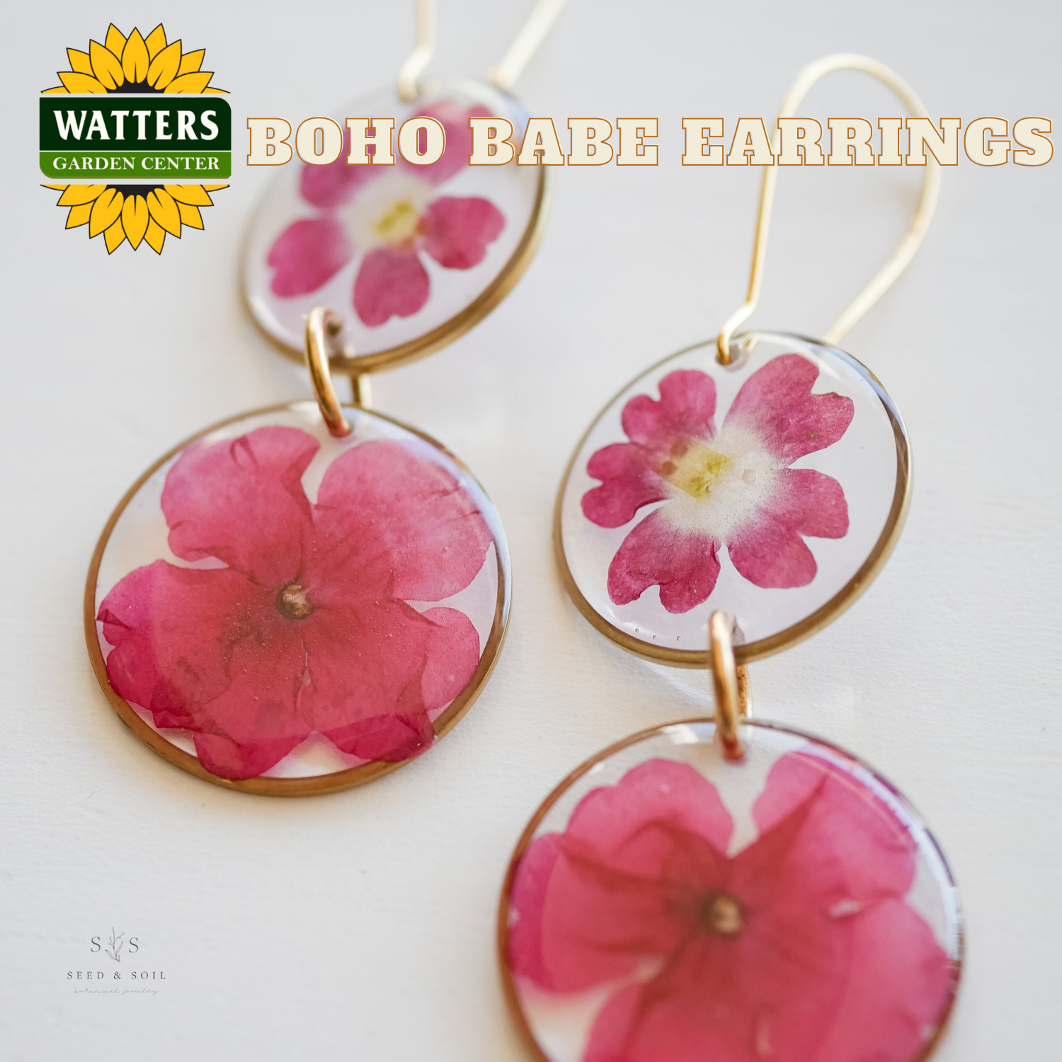 Boho Babe earrings with pink flowers on a white background, featuring Watters Garden Center branding.