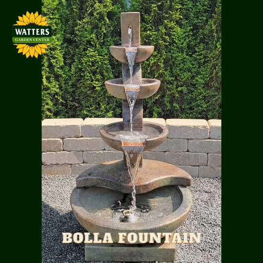 Tiered fountain in a garden with Watters logo.