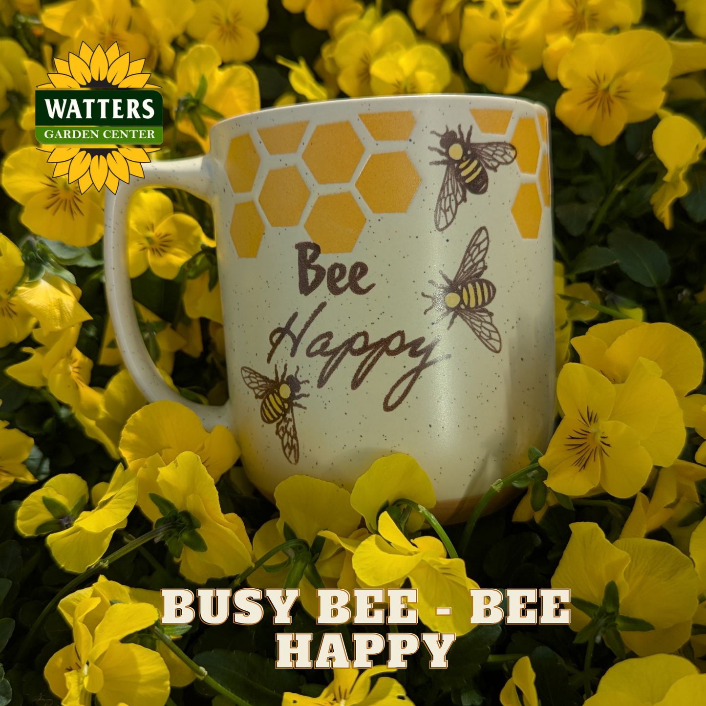 Mug with 'Bee Happy' design surrounded by yellow flowers, featuring Watters Garden Center logo.
