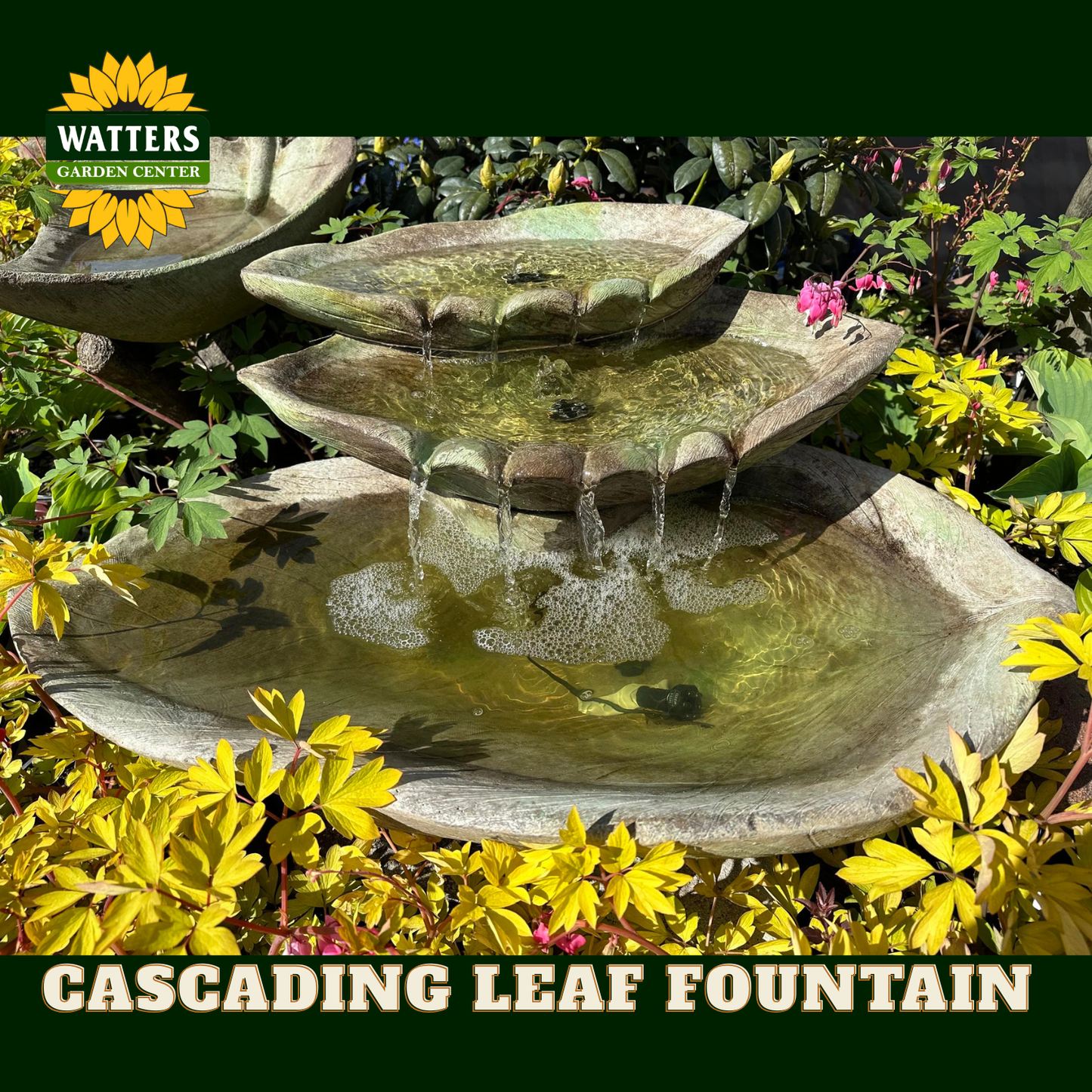 A three-tier cascading leaf fountain made of stone, shown outdoors surrounded by yellow and green garden foliage. Water flows from the top tier to the middle, and finally into the bottom basin.