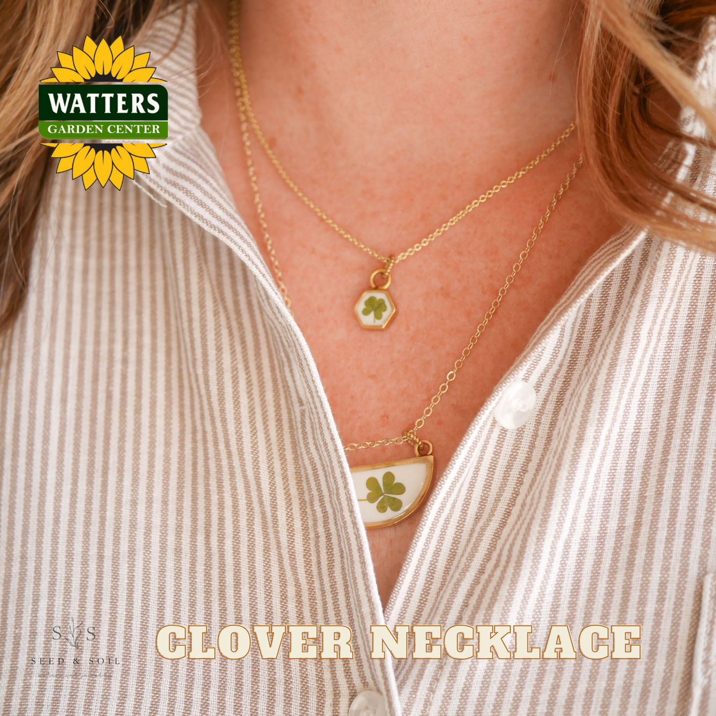 Gold necklace with clover pendants worn by a person, featuring Watters Garden Center logo.
