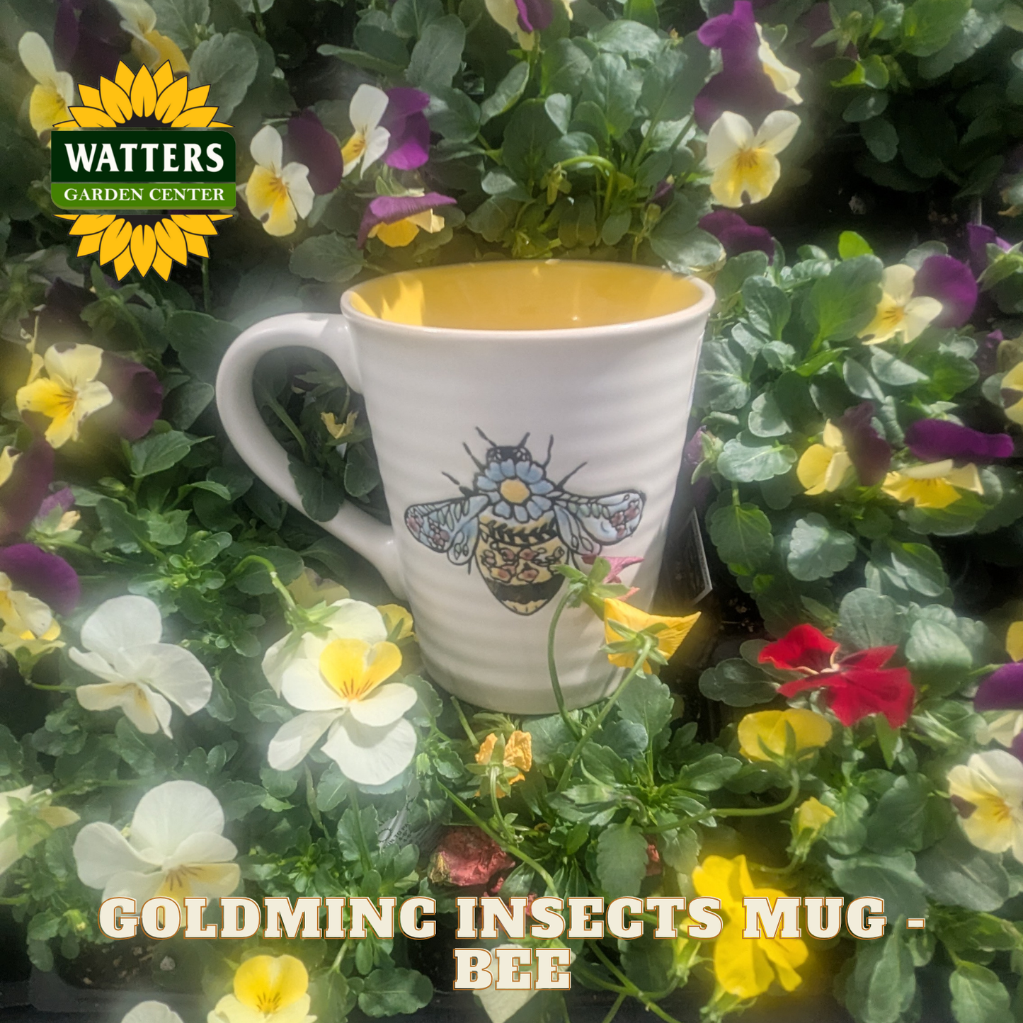 White mug with bee design on a bed of flowers, featuring Watters Garden Center logo.
