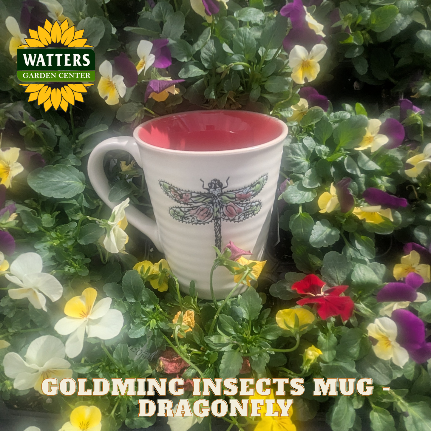 White mug with red interior, dragonfly design, surrounded by colorful flowers with Watters Garden Center logo.