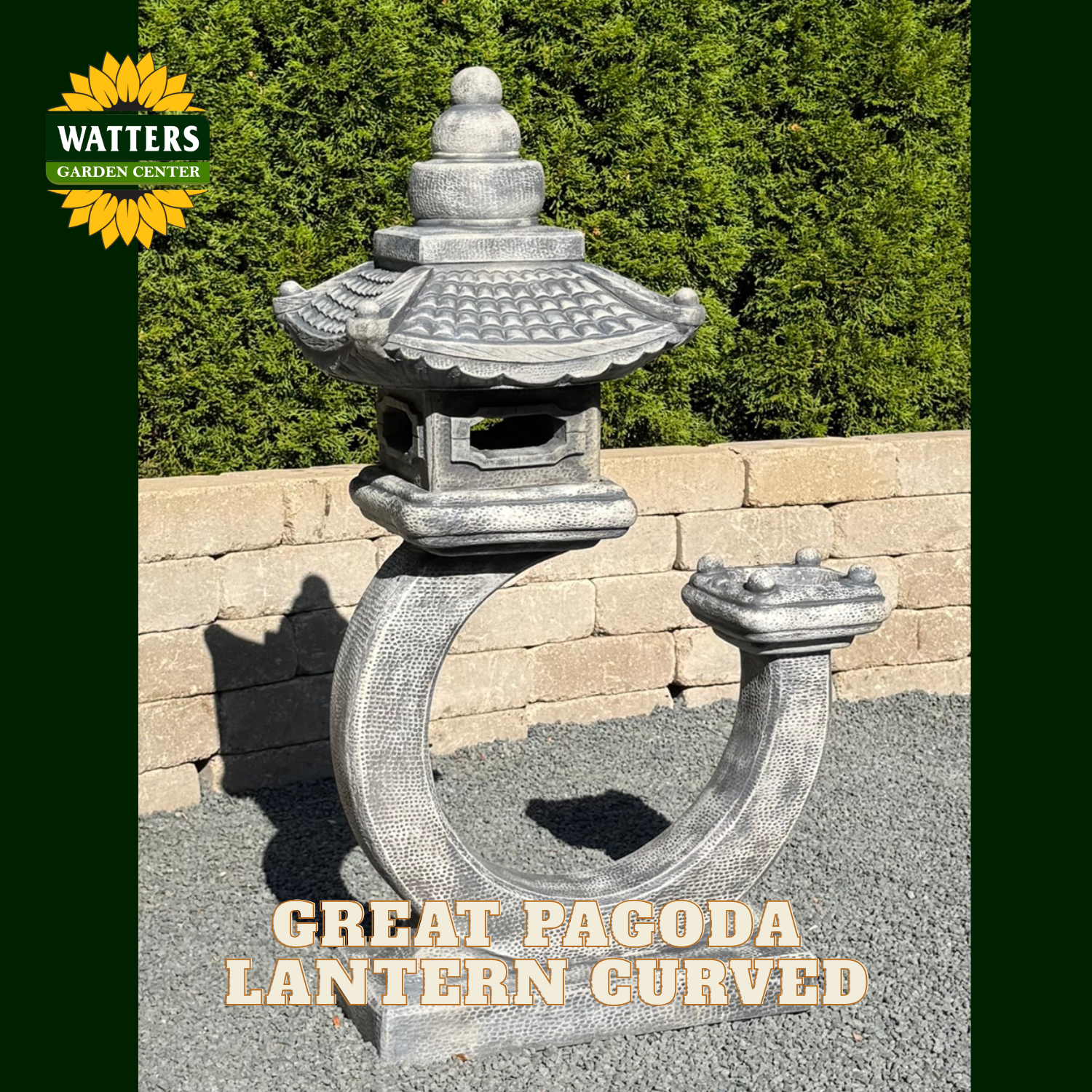 A stone-style curved pagoda lantern garden ornament with a tiered roof and open side panels, shown outdoors on gravel in front of a tan stone wall and green hedge. The Watters Garden Center logo appears in the top left, and the text 'GREAT PAGODA LANTERN CURVED' is overlaid at the bottom.