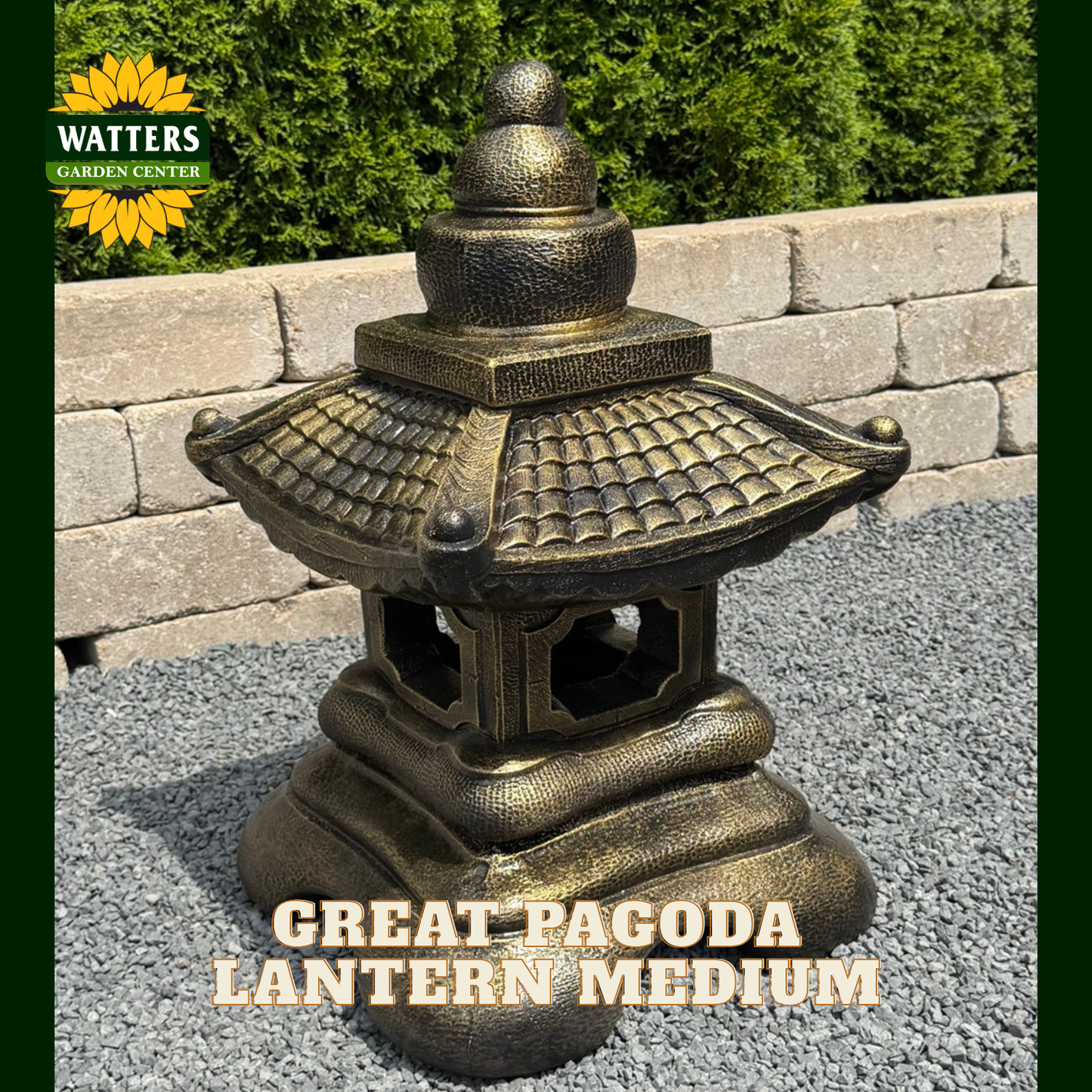 A bronze-finished Great Pagoda Lantern from Watters Garden Center, shown outdoors on a gravel surface with a stone wall and green shrubs in the background. The image features a dark green border and text overlays reading 'WATTERS GARDEN CENTER' and 'GREAT PAGODA LANTERN MEDIUM'.