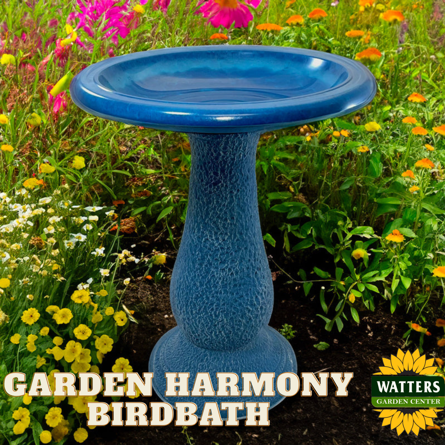 Blue garden birdbath in a colorful flower garden with 'Garden Harmony Birdbath' text and Watters Garden Center logo.