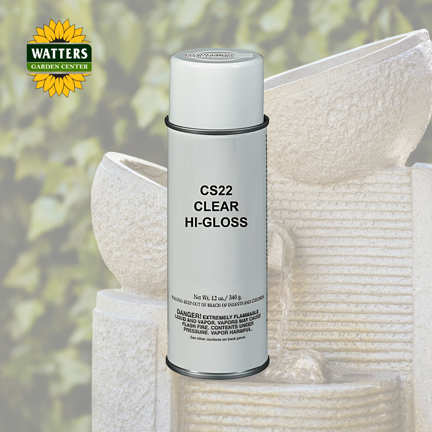 A can of Watters Gardens Center CS22 Clear Hi-Gloss paint spray, shown in front of a background of white stone garden planters with a soft green garden foliage backdrop.