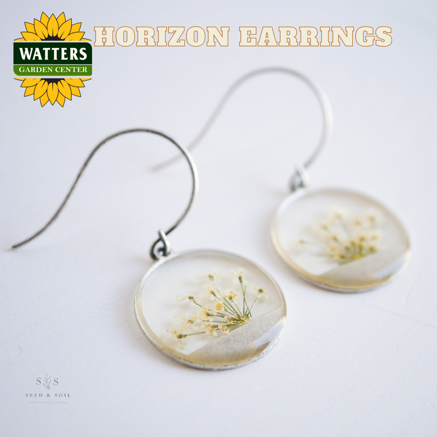 Horizon earrings with floral design on a white background, featuring Watters Garden Center logo.
