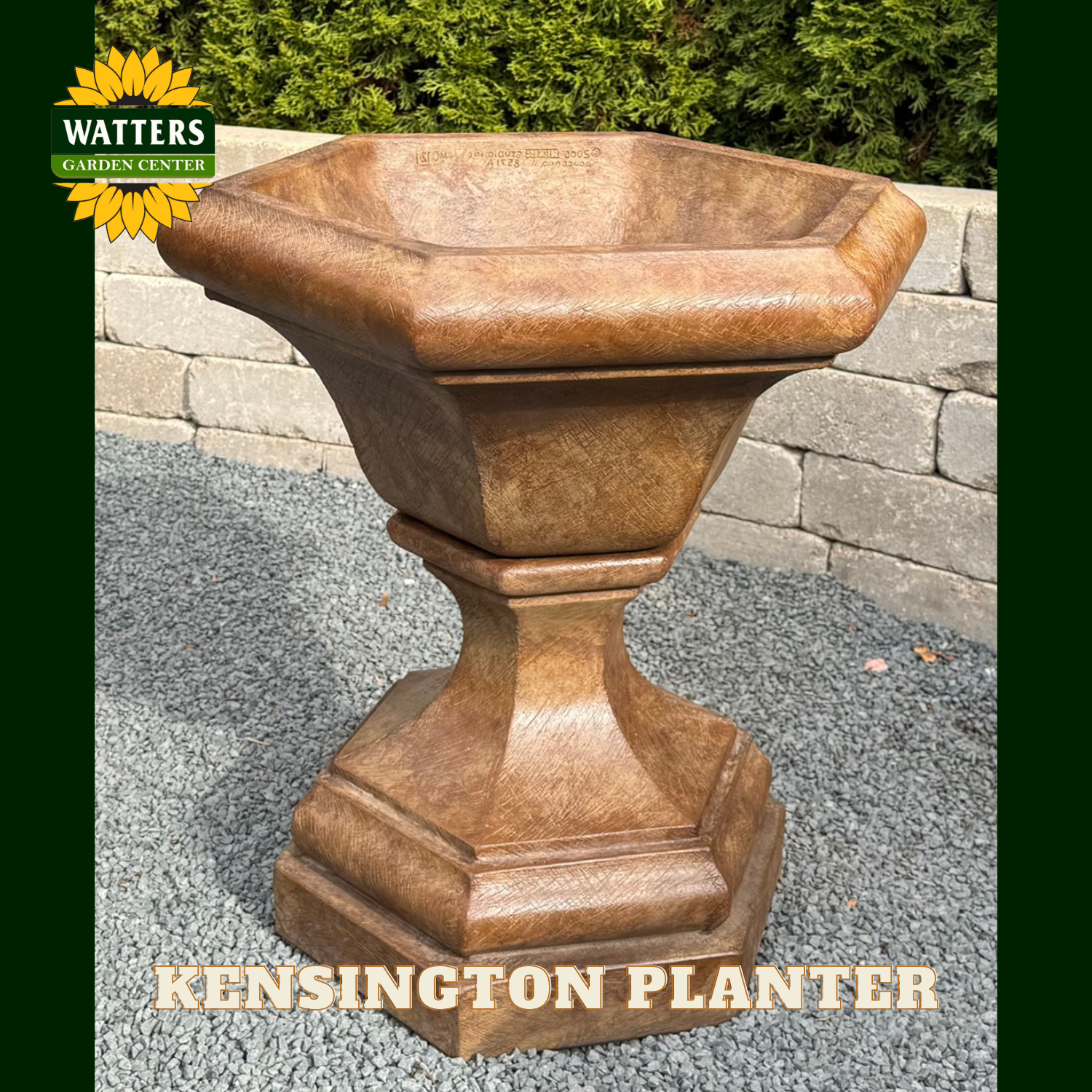 Tan Kensington planter in a garden setting with Watters branding.