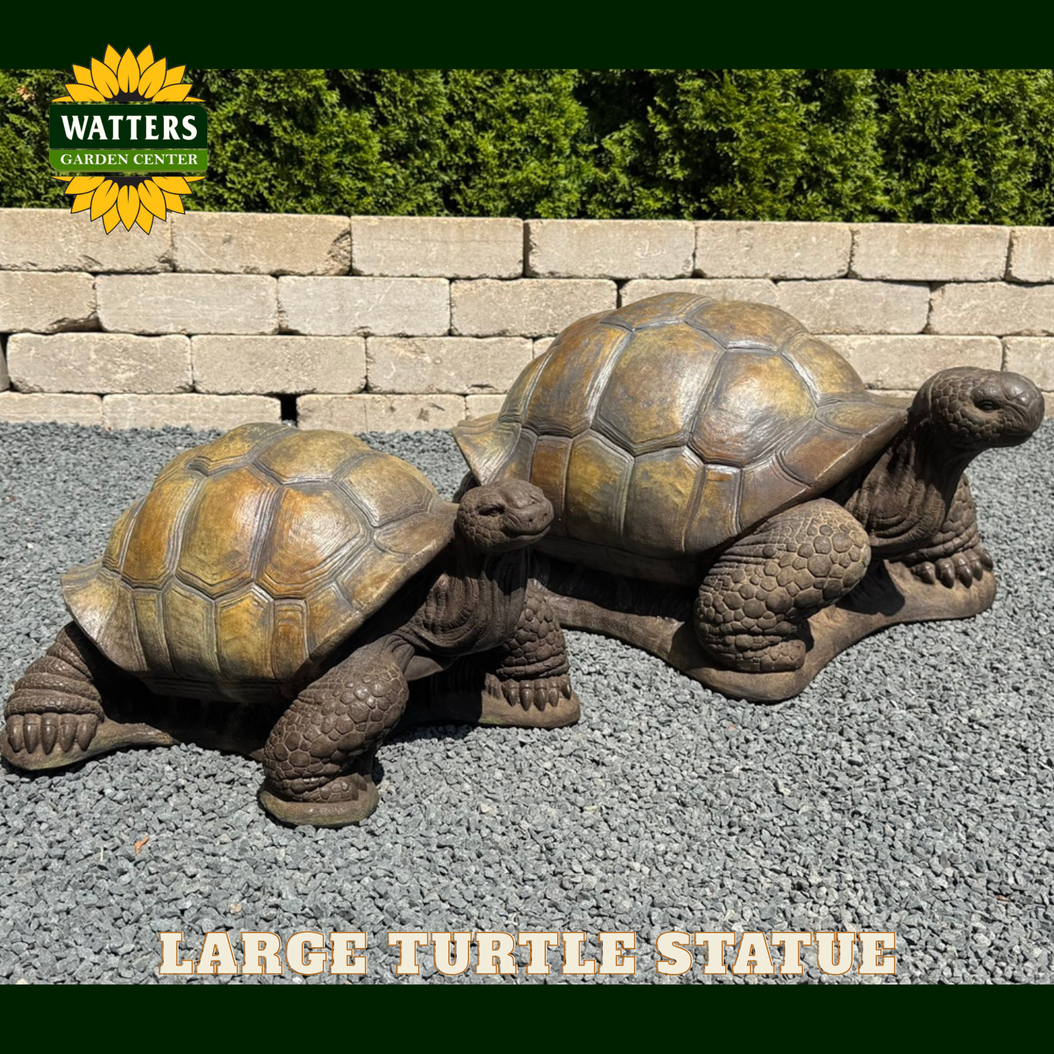 Two turtle statues (large and medium) on gravel.