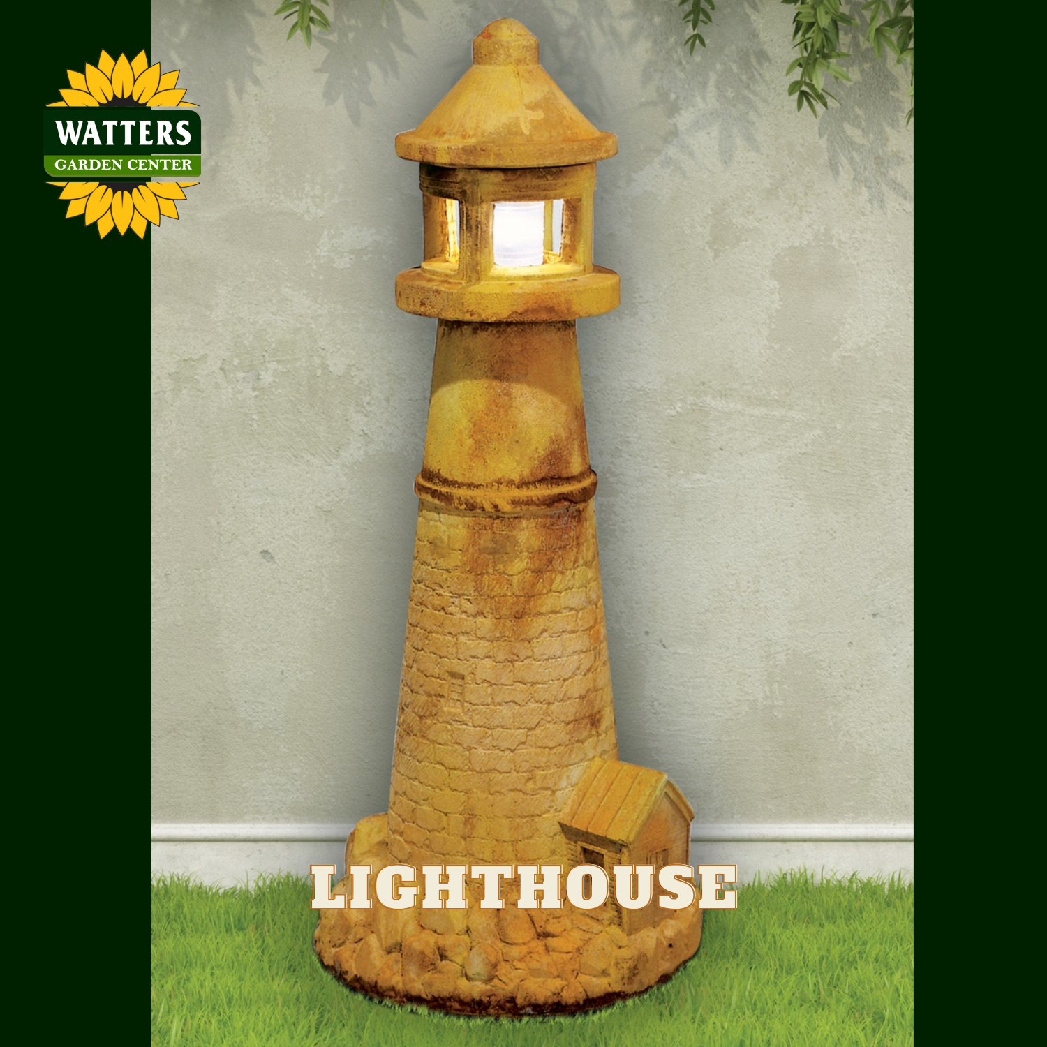 A decorative lighthouse garden light with a warm glowing window, shown standing on artificial grass against a textured wall. The Watters Gardens Center logo appears in the top left, and the word 'LIGHTHOUSE' is printed at the bottom.