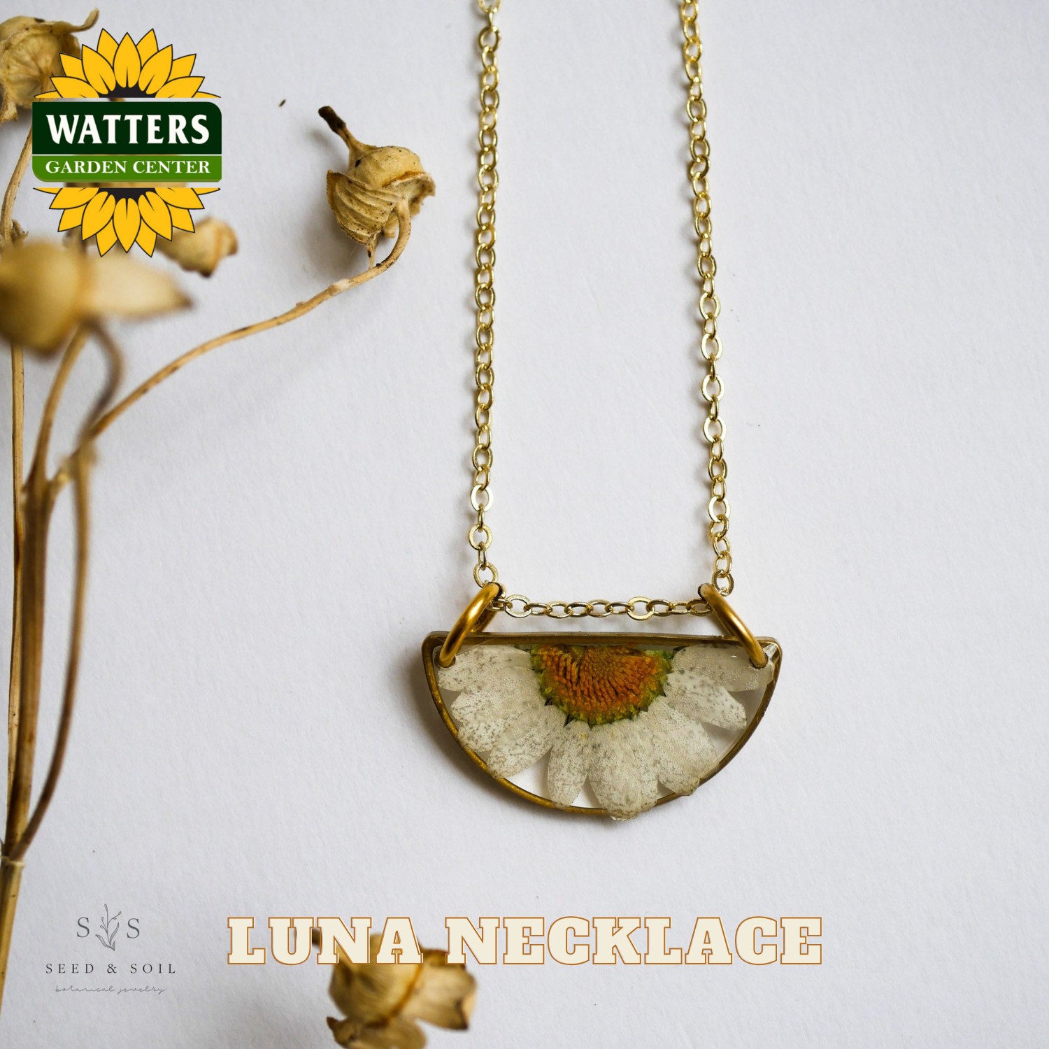 Luna necklace with dried flower design on a white background, featuring Watters Garden Center logo.