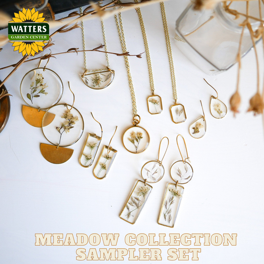Jewelry set with floral elements on a white surface, featuring Watters Garden Center branding.