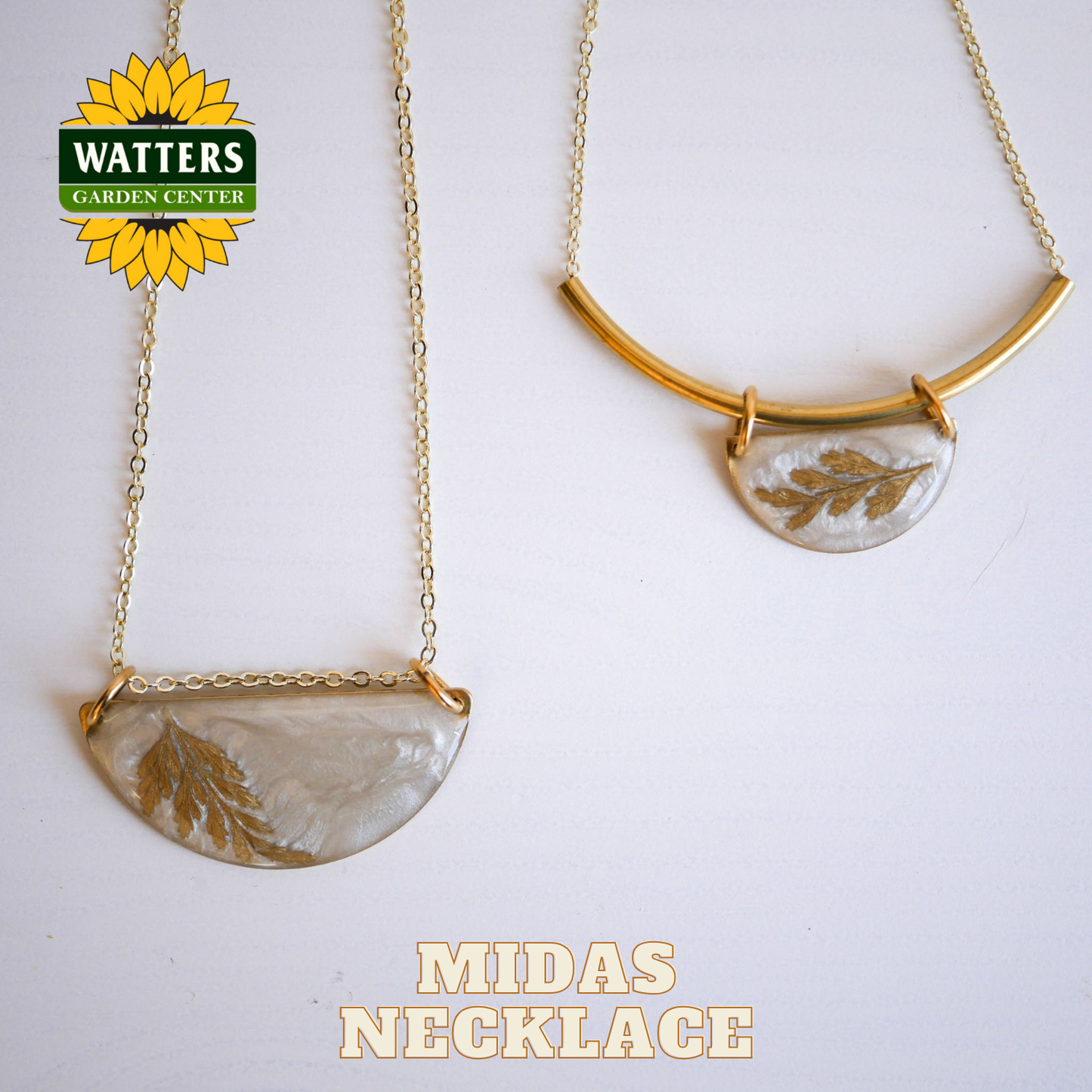 Gold necklace with leaf design on a white background, featuring Watters Garden Center logo.