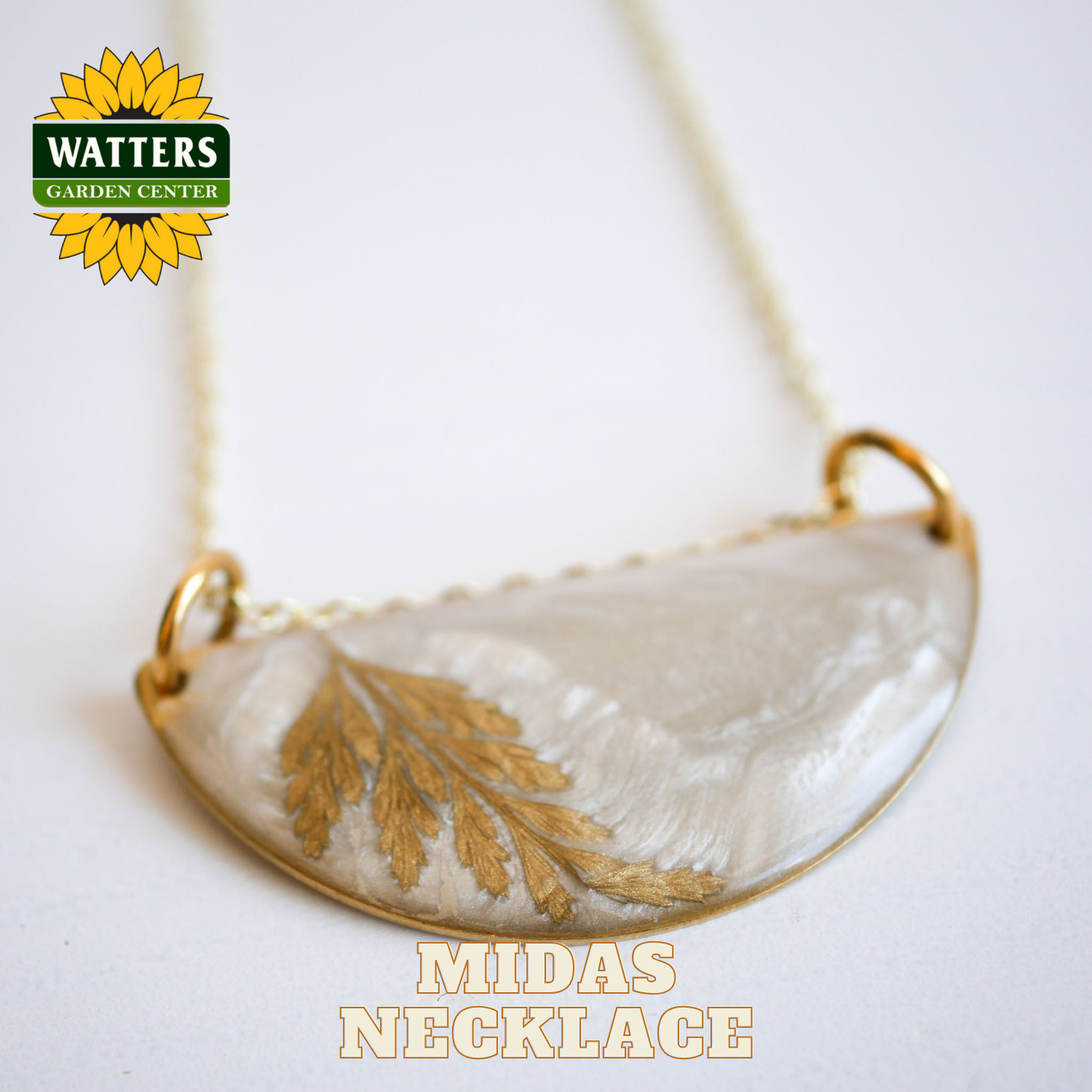 Necklace with a leaf design on a white background, featuring Watters Garden Center logo.