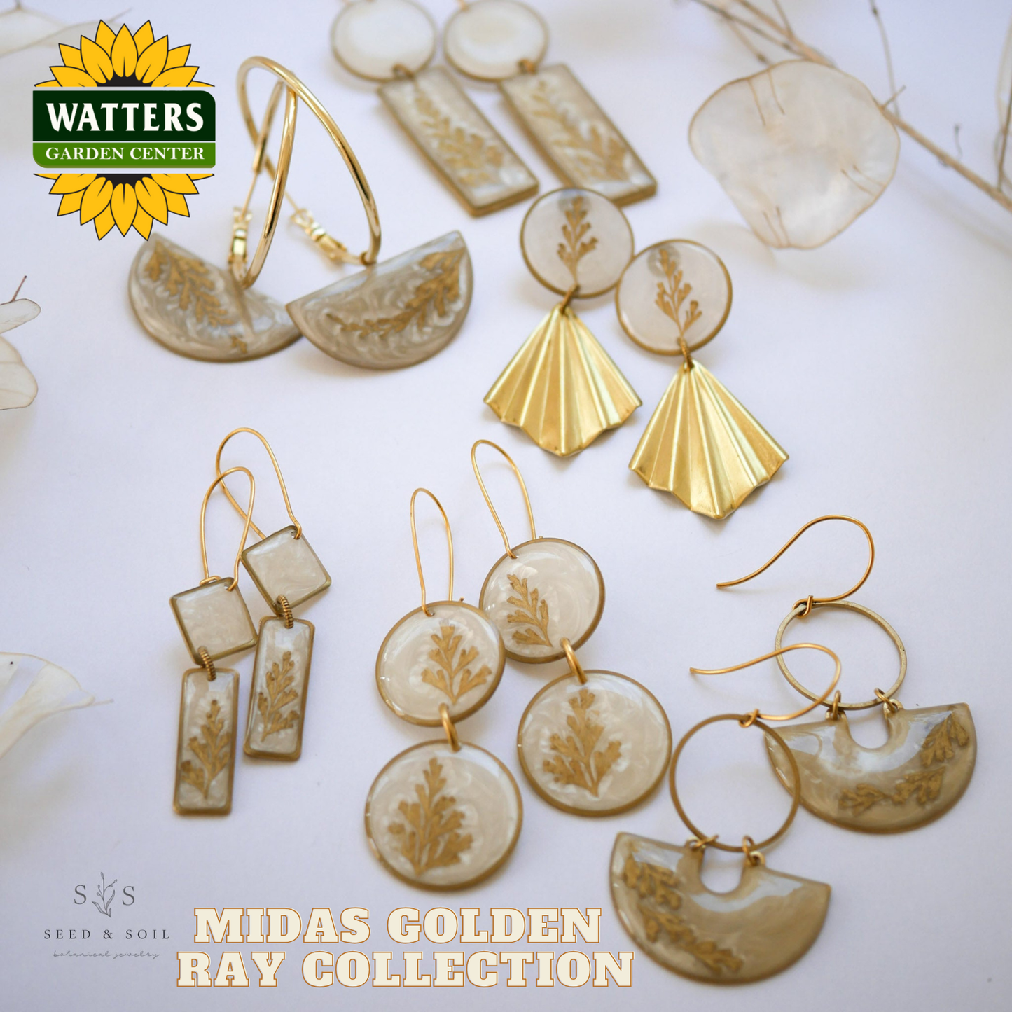 Gold and beige earrings with 'Watters Garden Center' and 'Seed & Soil' branding on a white background.