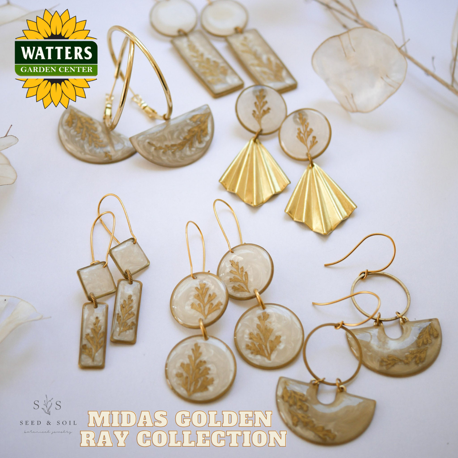 Gold and beige earrings with 'Watters Garden Center' and 'Seed & Soil' branding on a white background.