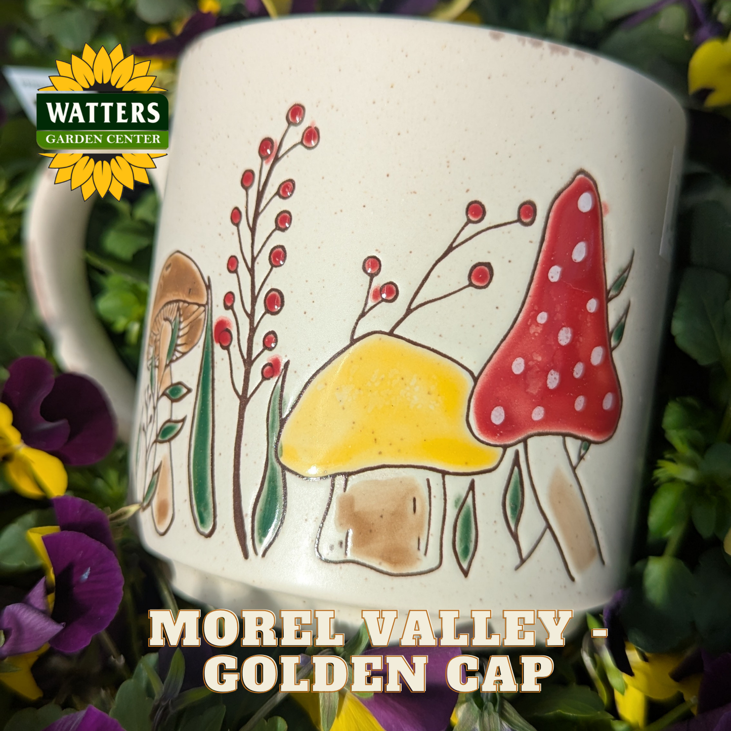Mug with mushroom design surrounded by flowers and plants, featuring Watters Garden Center branding.