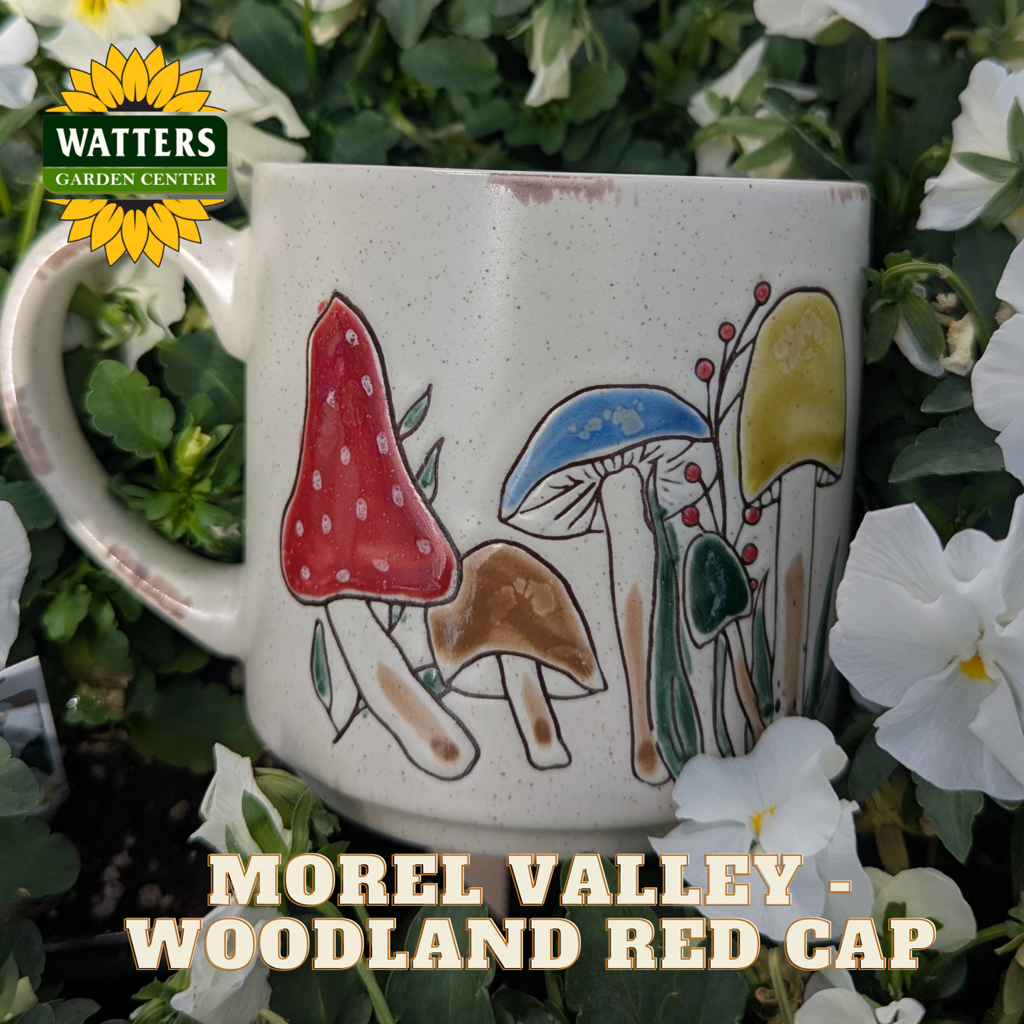 Mug with mushroom design in a garden setting, featuring Watters Garden Center logo.
