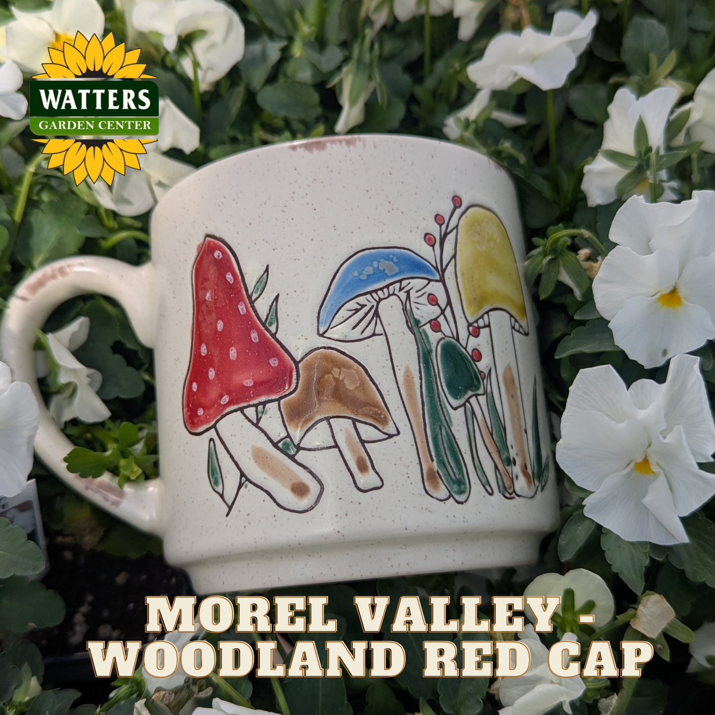 Mug with mushroom design surrounded by flowers and greenery, featuring Watters Garden Center branding.