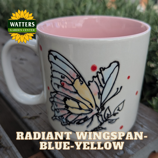 White mug with butterfly design and pink interior, Watters Garden Center logo visible