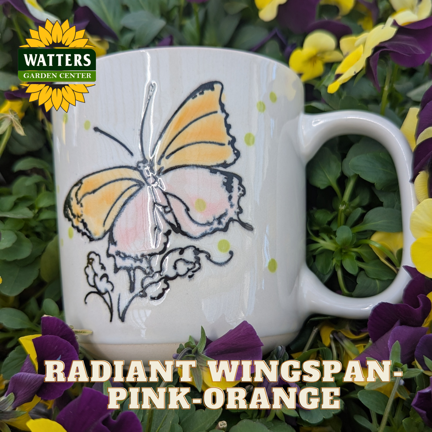 White mug with butterfly design surrounded by flowers and greenery, featuring Watters Garden Center logo.