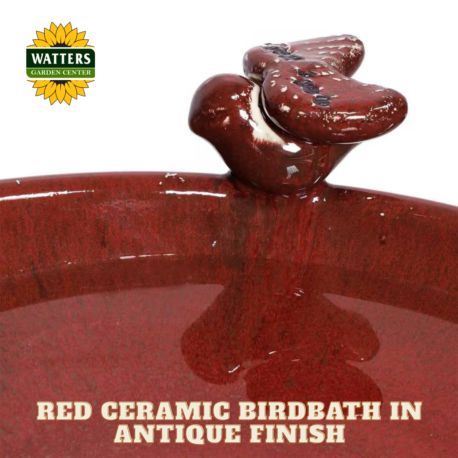 Red ceramic birdbath with antique finish and Watters Garden Center logo.