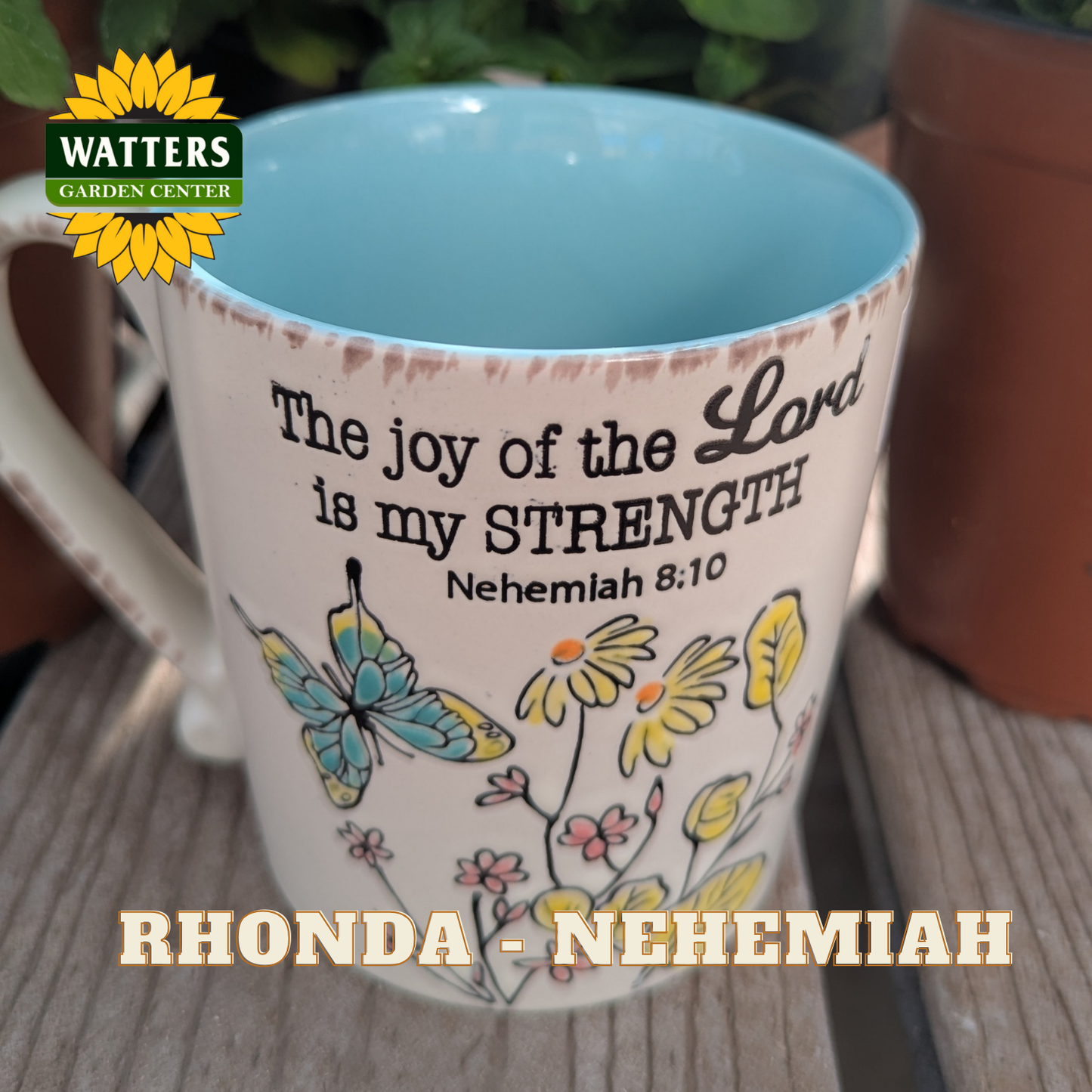 Mug with motivational quote and butterfly design, featuring Watters Garden Center logo.