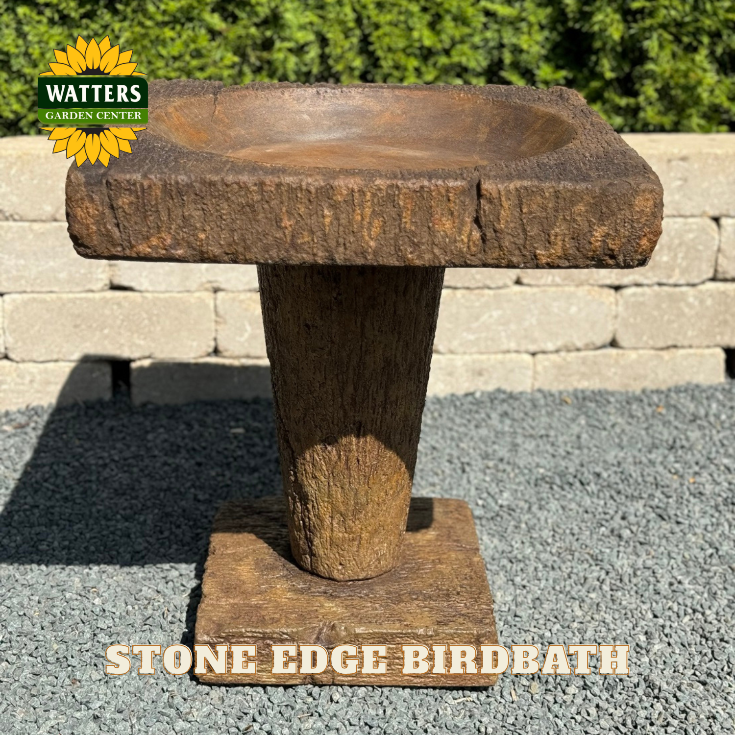 Wooden bird bath with 'Watters Garden Center' logo in the corner