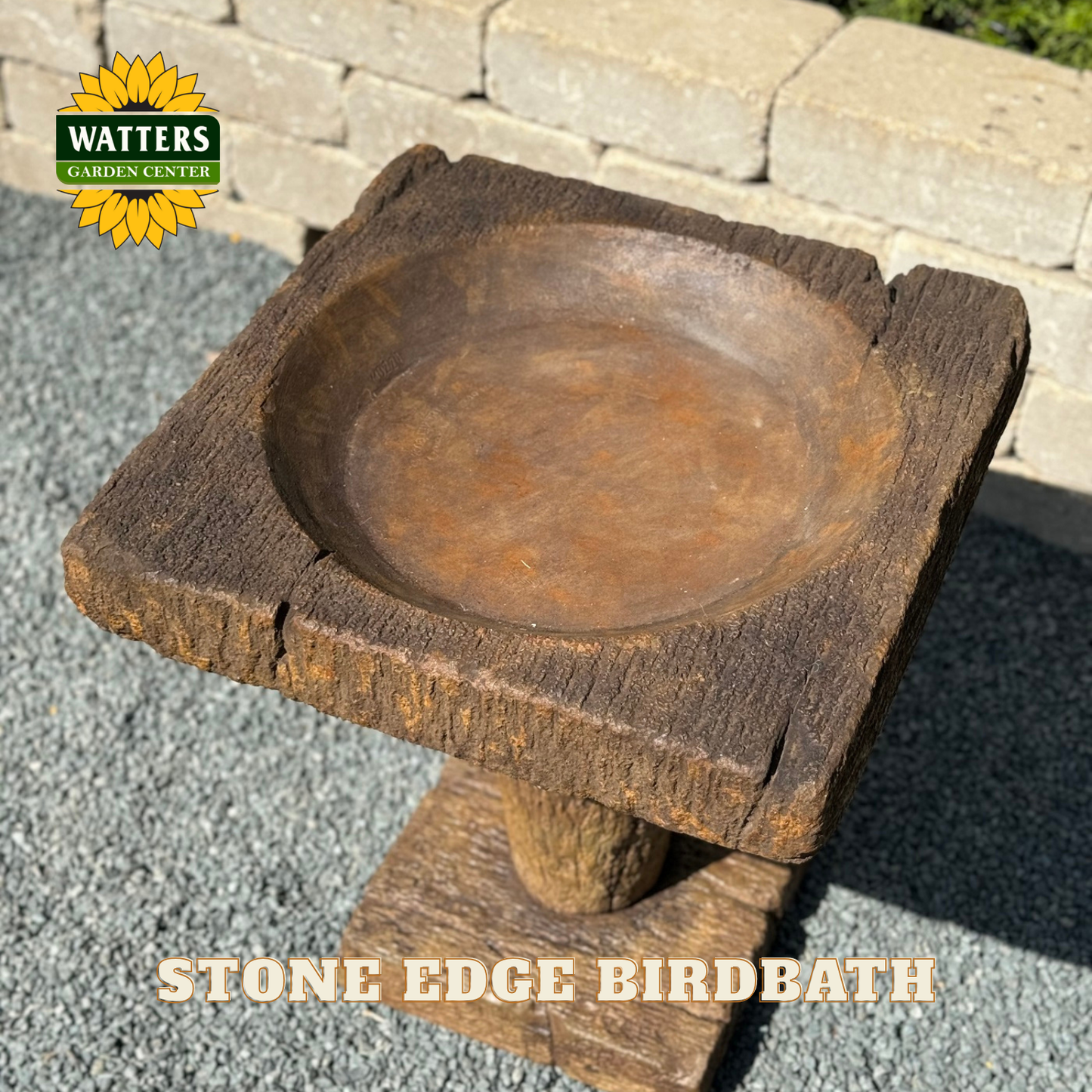 Stone edge birdbath with Watters Garden Center logo