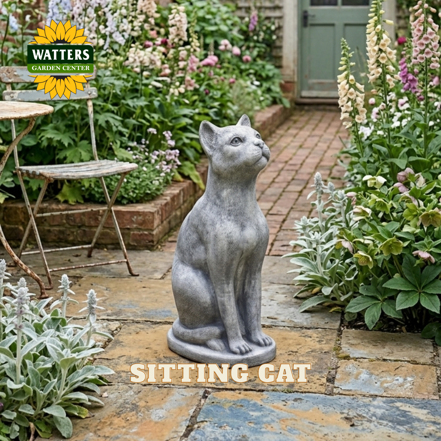 A gray stone-look statue of a sitting cat placed on a garden patio, surrounded by flowers, plants, and a brick path. The Watters Garden Center logo appears in the top left, and the words 'SITTING CAT' are overlaid at the bottom.