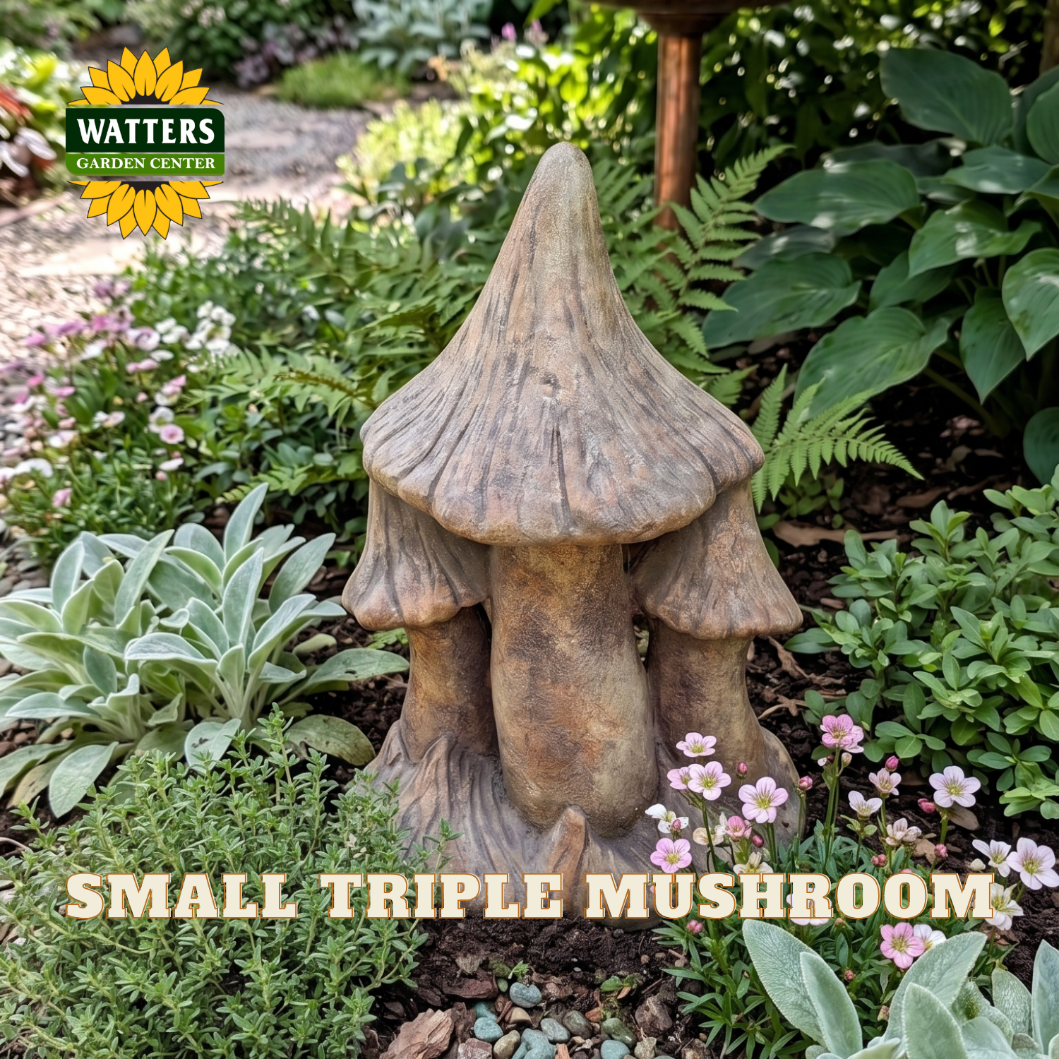 A small triple mushroom garden statue with a textured, weathered brown and beige finish, displayed in a lush garden setting. The Watters Gardens Center logo is visible in the top left, and the text 'SMALL TRIPLE MUSHROOM' is overlaid at the bottom.