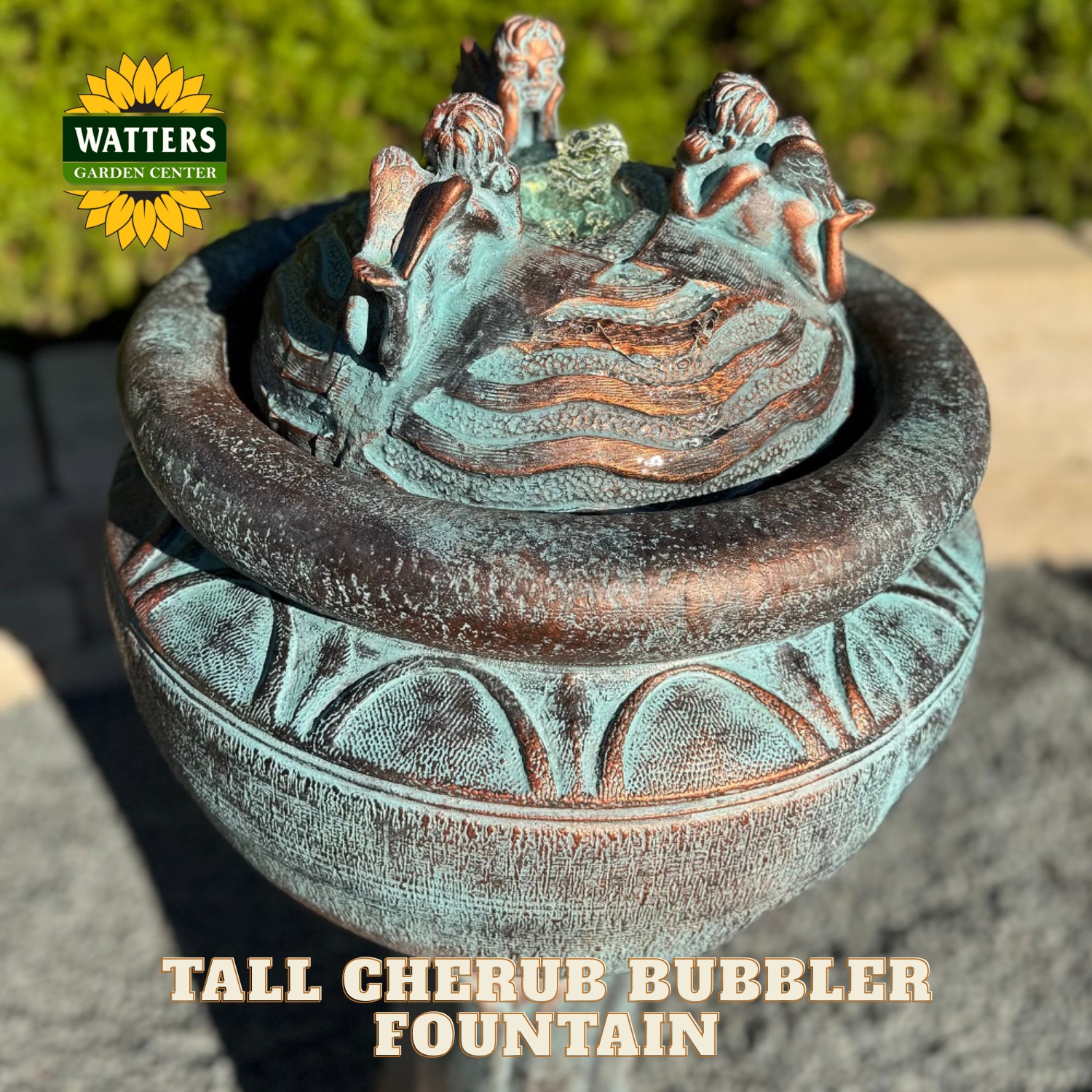 Tall cherub bubbler fountain with decorative elements on a blurred background