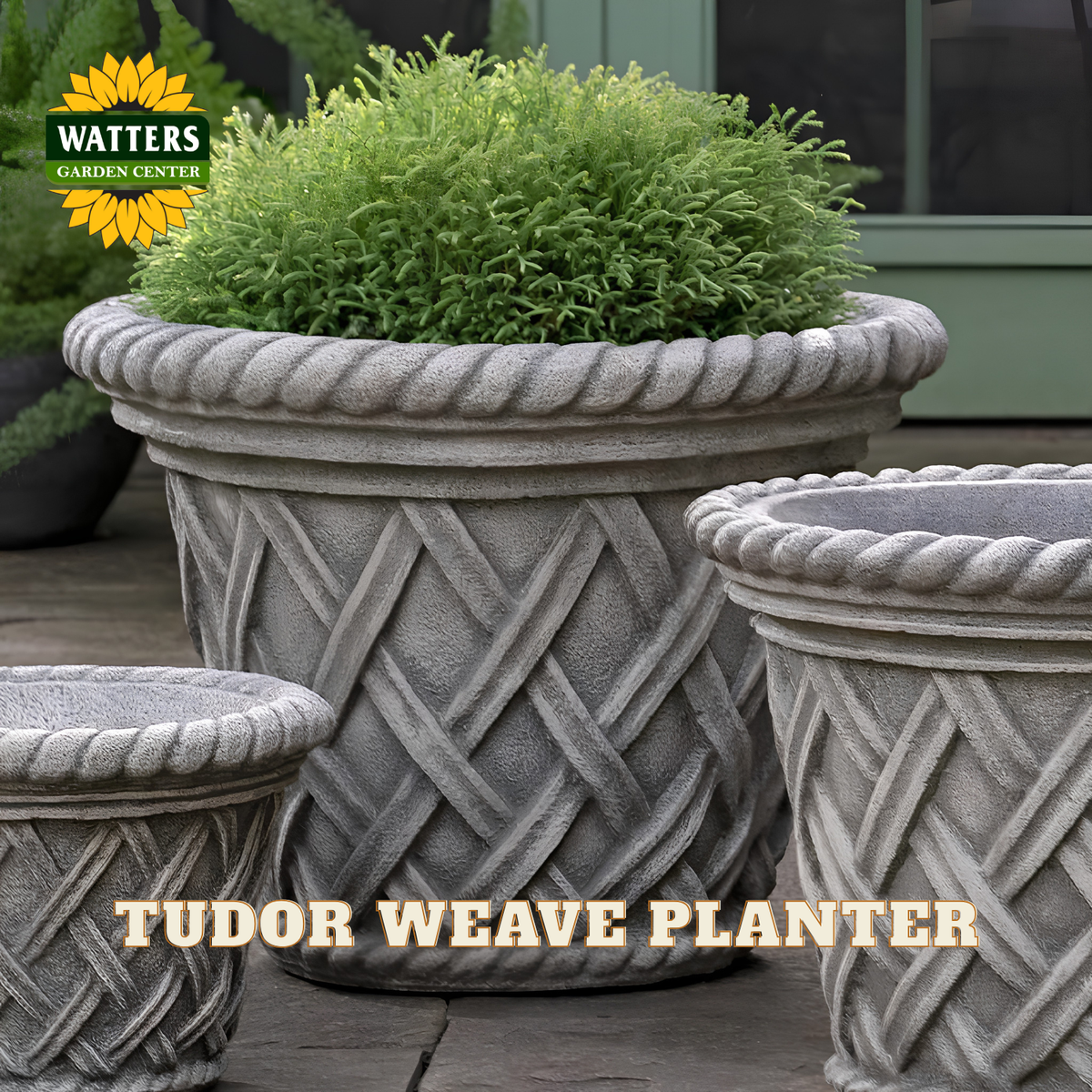 Gray stone-look planter pots with a woven lattice pattern and rope trim, shown with green foliage on a patio. The Watters Garden Center logo appears in the top left, and the text 'TUDOR WEAVE PLANTER' is overlaid at the bottom.