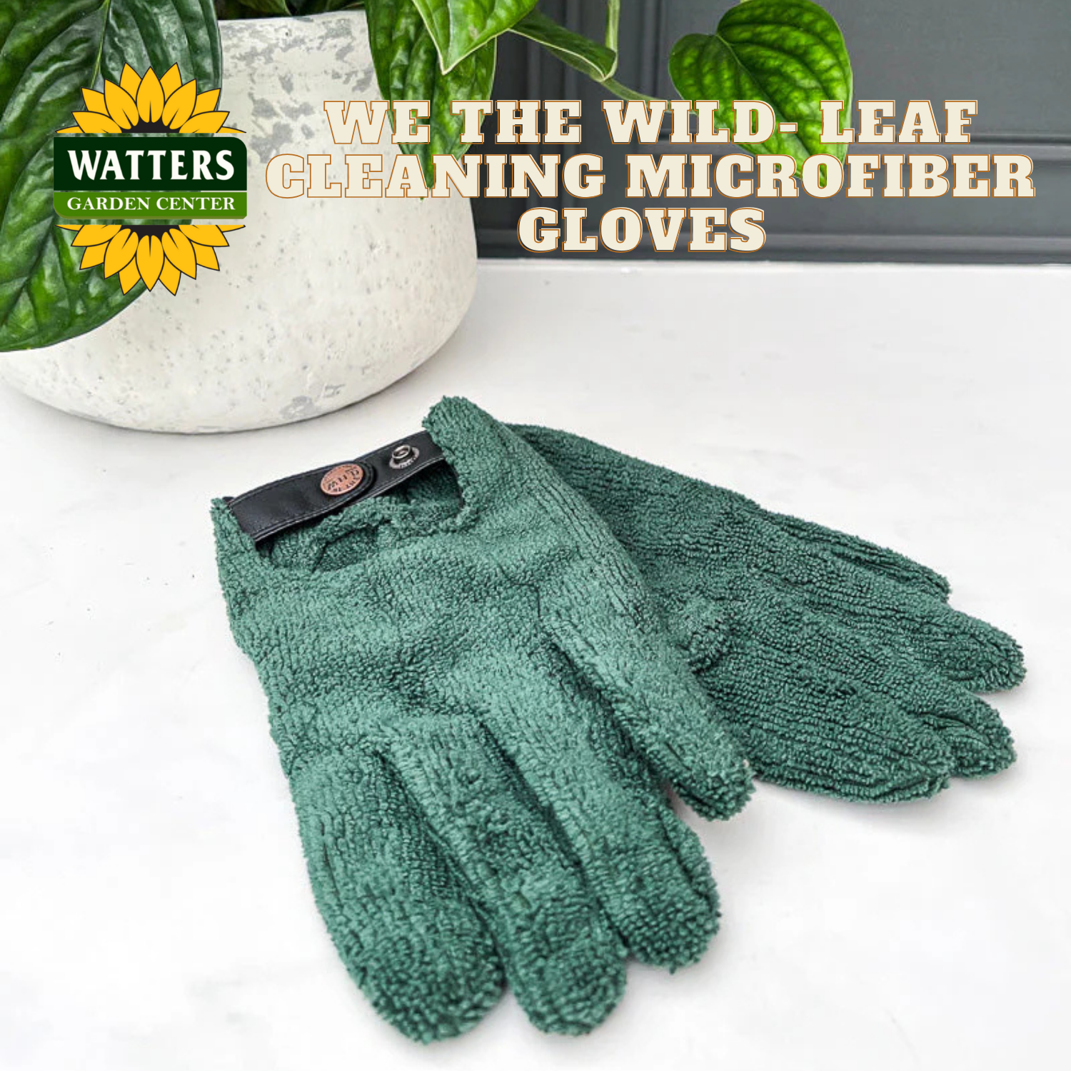 Green cleaning microfiber gloves with Watters Garden Center logo on a white background