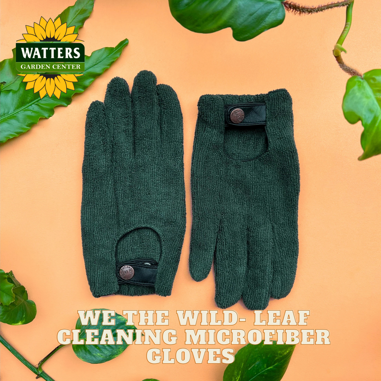 Pair of green gardening gloves with leaf cleaning microfiber on a beige background, featuring Watters Garden Center logo.