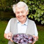 plum older woman with harvest