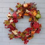 autumn-wreath-with-gourdes-berries-and-fall-leaves-450x600