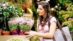 Female shopper buying flowers