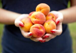 Holding Peaches in her hands