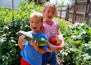 Kids with Tomatoes and squash