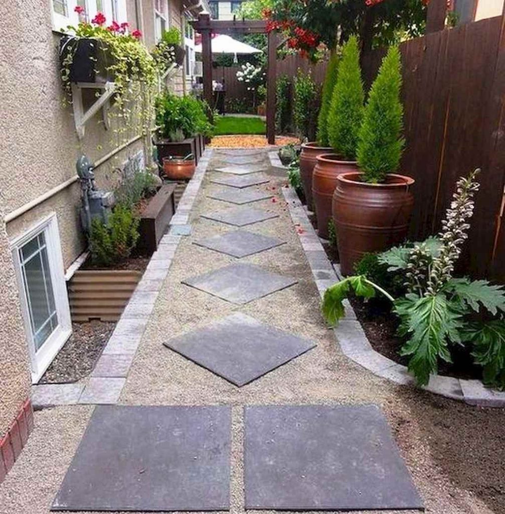 Sidewalk lined with plants