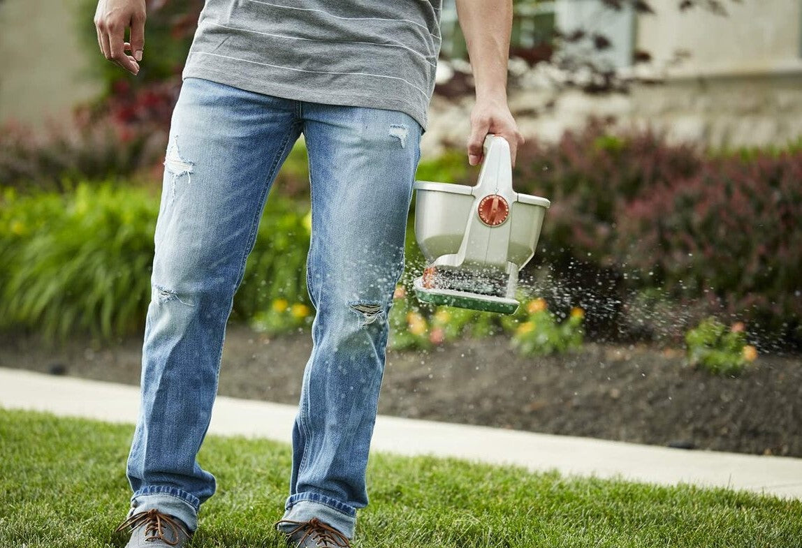 Man fertilizing his lawn